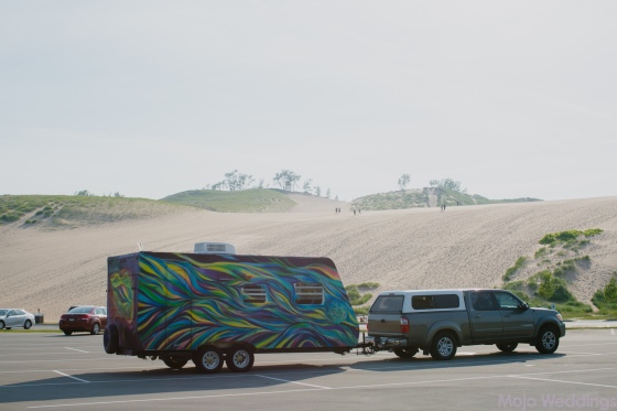 Our colorful trailer parked in front of the Sleeping Bear Dunes.